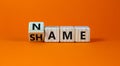 Name or shame symbol. Turned the cube and changed cube and changes the word `shame` to `name` or vice versa. Beautiful orange