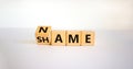 Name or shame symbol. Turned the cube and changed cube and changes the word `shame` to `name` or vice versa. Beautiful white