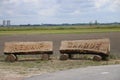 Name sign created from tree trunks of the Hennipgaarde which is a polder designed by the residents of Zevenhuizen in the netherlan