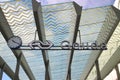 Name sign of Gouda on the entrance of train station with solar panels in the glass roof.