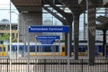 Name signs in droste effect with trains on Rotterdam Centraal Sttion Platform