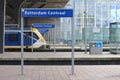 Name signs in droste effect with trains on Rotterdam Centraal Sttion Platform