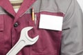 Name tag on uniform and wrench Royalty Free Stock Photo