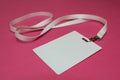 Name tag with white neckband isolated on pink background