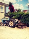 The name of this tractor is ford, it is a very old model.  But still going on. Royalty Free Stock Photo