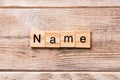 NAME word written on wood block. NAME text on wooden table for your desing, concept Royalty Free Stock Photo