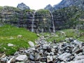 Nameless waterfalls under the Alpine peaks Glarner Vorab and BÃÂ¼nder Vorab in the valley of Im Loch