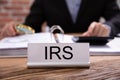 Nameplate With IRS Title Kept On Businessman Desk Royalty Free Stock Photo