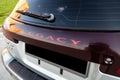 Nameplate on the trunk of Subaru Legacy Lancaster japanese car in beige color on the parking