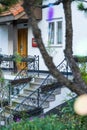 Namhae,South Korea-November 2020: European style house with stairs surrounded by green trees