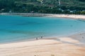 Namhae,South Korea-November 2020: People at the Blue clear water beach with mountain view at Namhae, South Korea