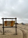 Namib Naukluft park entrance road sign. Sandwich harbour in Namibia desert. Royalty Free Stock Photo