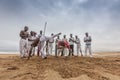 NAMIBE/ANGOLA - 28 AUG 2013 - African sportsmen practicing the famous Brazilian capoeira fight