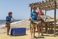 NAMIBE/ANGOLA - 03NOV2018 - Group of children just returned from a fishing morning with fish in hand