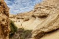 NAMIBE/ANGOLA - 03NOV2018 - Tourists walking in the canyons of the Namibe Desert. Africa. Angola Royalty Free Stock Photo