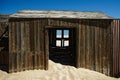 Namibia diamond mines - abandoned shed filling with sand.