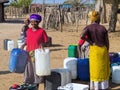 NAMIBIA, Kavango, OCTOBER 15: Women in the village waiting for water. Kavango was the region with the Highest poverty lev Royalty Free Stock Photo