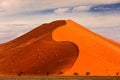 Namibia landscape. Big orange dune with blue sky and clouds, Sossusvlei, Namib desert, Namibia, Southern Africa. Red sand, biggest Royalty Free Stock Photo