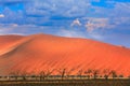 Namibia landscape. Big orange dune with blue sky and clouds, Sossusvlei, Namib desert, Namibia, Southern Africa. Red sand, biggest Royalty Free Stock Photo