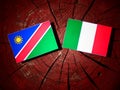 Namibian flag with Italian flag on a tree stump isolated