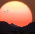 Namibian sunset and a powered hang glider Royalty Free Stock Photo