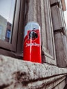 Can of Jupiler lager beer abandoned on a window sill outside