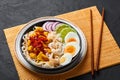 Nan Gyi Thoke in black bowl at dark slate background. Nan gyi Thohk is popular burmese cuisine dish