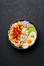 Nan Gyi Thoke in black bowl at dark slate background. Nan gyi Thohk is popular burmese cuisine dish