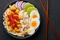 Nan Gyi Thoke in black bowl at dark slate background. Nan gyi Thohk is popular burmese cuisine dish