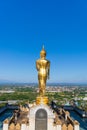 The standing golden Buddha at a hill or valley at Wat phra that khao noi,Nan Thailand.