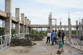 Supervisor and engineers are checking the correctness of building construction.
