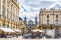 Sidewalk cafe on the Stanislas square and cathedral in Nancy, France