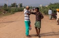 2 young male adults meet each other Nandakeshwar Karnataka India