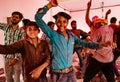 Young men dance during Holi Festival in India