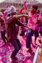 Young men dance during Holi Festival in India