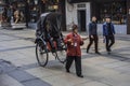 A man who pulls a rickshaw in nanjing Confucius temple.