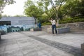 Middle-aged man playing gyro at Xuanwumen Square Royalty Free Stock Photo