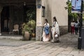 Two young girls wearing ancient costume walking in the scenic area