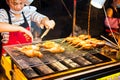 NANNING, CHINA - JUNE 9, 2017: Chinese chef preparing barbecue o