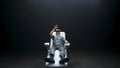 Nano technologies gamer immersed VR dark room. Man enjoying haptic gloves chair