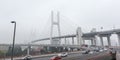 Nanpu Bridge in Shanghai with Cityscape and Foggy Sky