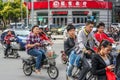 Nantong City / China - October 3, 2011 : Heavy traffic with many motorcycles and bicycle riders during rush hour