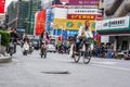 Heavy traffic with many motorcycles and bicycle riders during rush hour