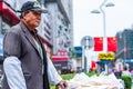 Nantong City / China - October 3, 2011 : Portrait of mature aged Asian Chinese man. He sells street snacks