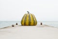 Naoshima, Japan - September 29, 2017: Yayoi Kusama`s pumpkin sculpture in front of the sea