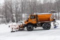 Snow-removing machine cleans the street