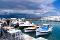 Traditional Greek taverna at Naoussa, Paros, with holiday makers dining.