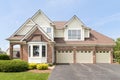 A large brick home with a 3 car garage. Royalty Free Stock Photo