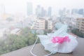 Napkin with blood because of air pollution in the city have particulate matters or PM 2.5 with city building background.