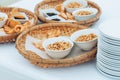 Napkin, bowls with raisins, peanuts, sunflower seeds